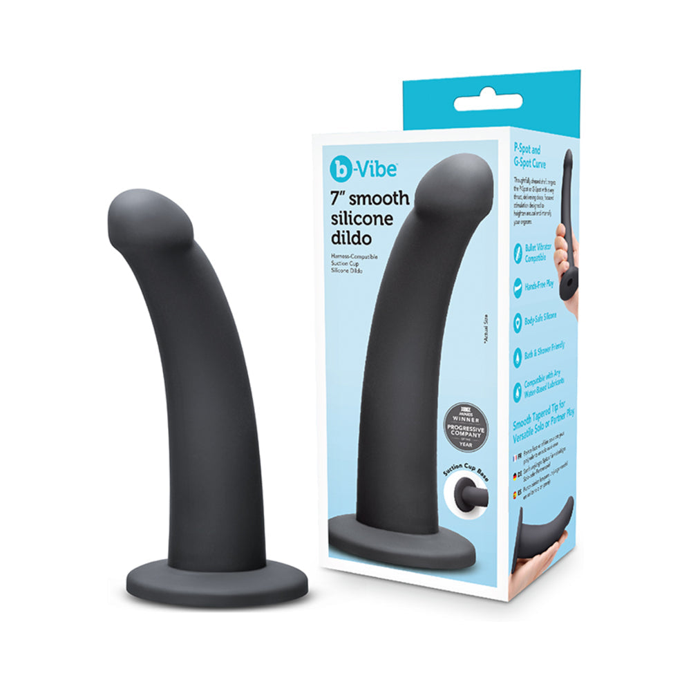 B-Vibe Essentials 7 Inch Smooth Silicone Dildo Black with sleek design and harness compatibility.