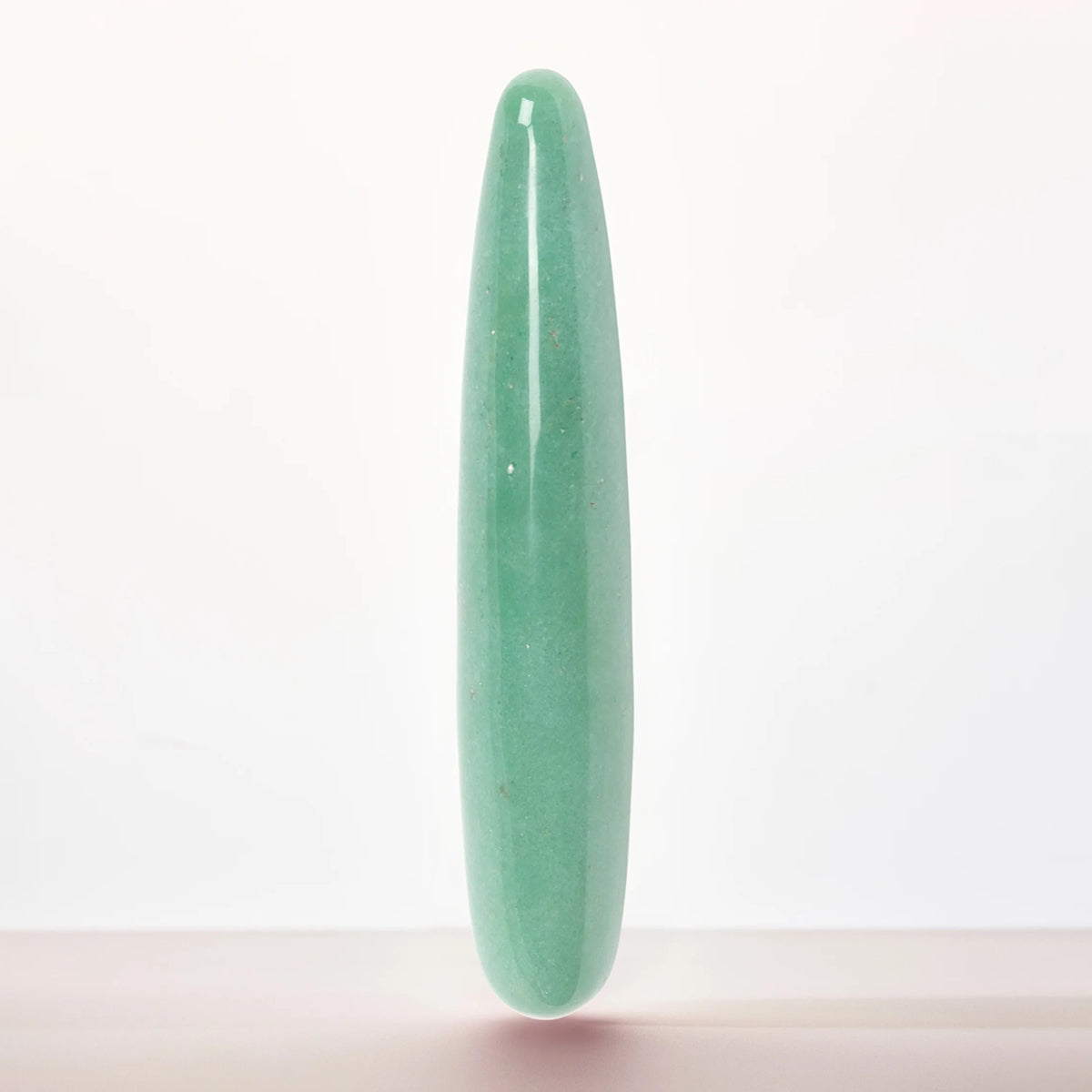 Chakrubs Indian Jade Slim Dildo showcasing its sleek design and natural beauty in jade.