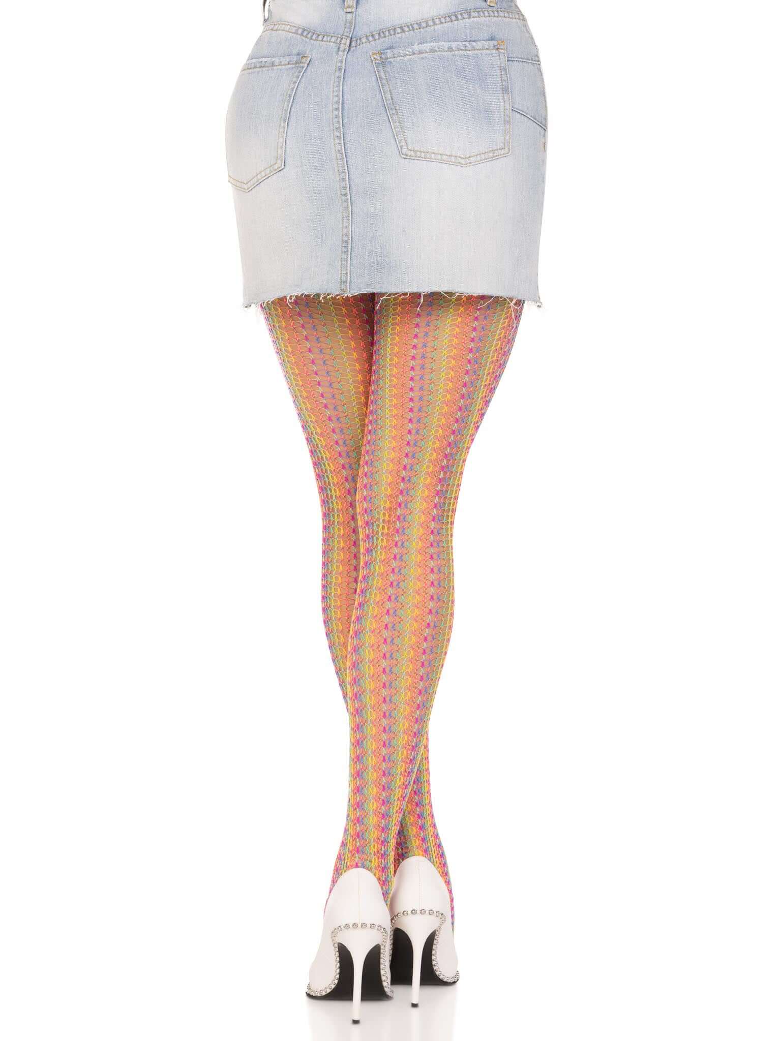 Woman wearing multicolor rainbow crochet net tights and white high heels with denim skirt.
