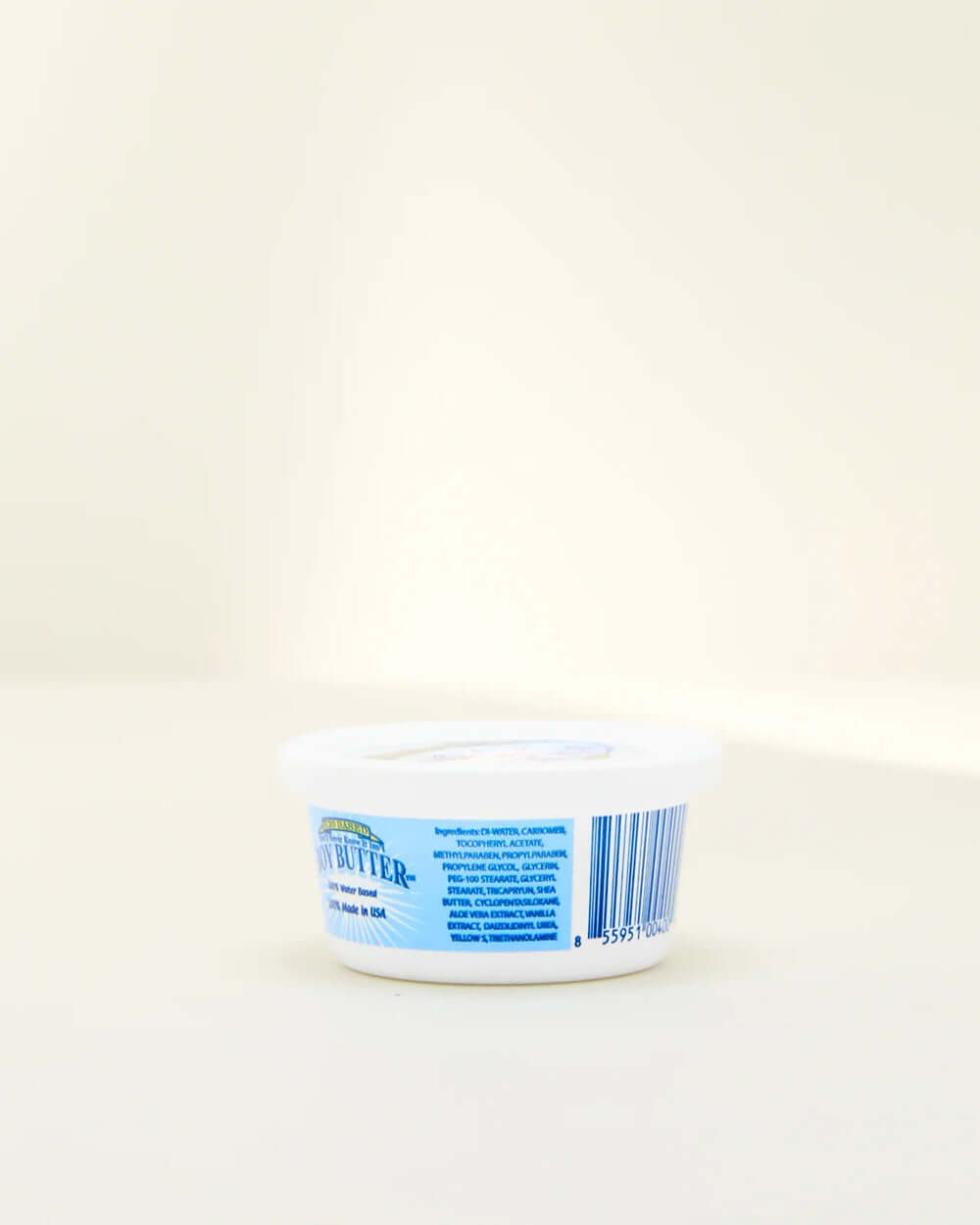 Boy Butter H2O Lubricant 4 Oz Tub side view displaying packaging and label details.