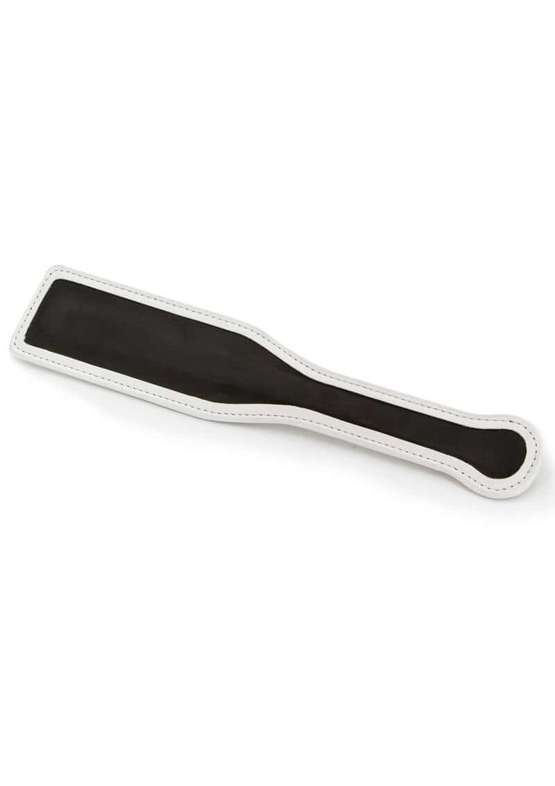 GLO Bondage Glow In The Dark Paddle Green, black paddle with white stitching for impact play, showcasing glow-in-the-dark design.