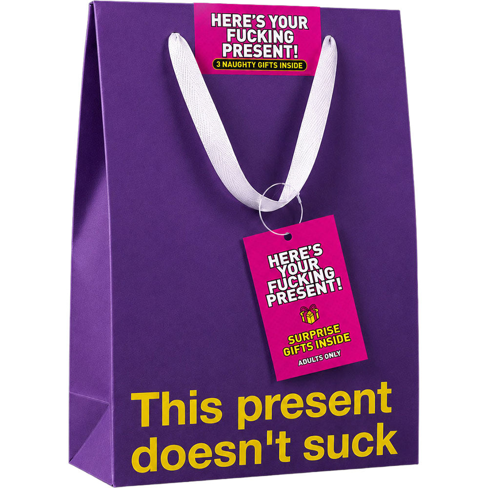 Wood Rocket Here's Your Fucking Present Gag Gift purple bag with humorous tags for adult gifting.