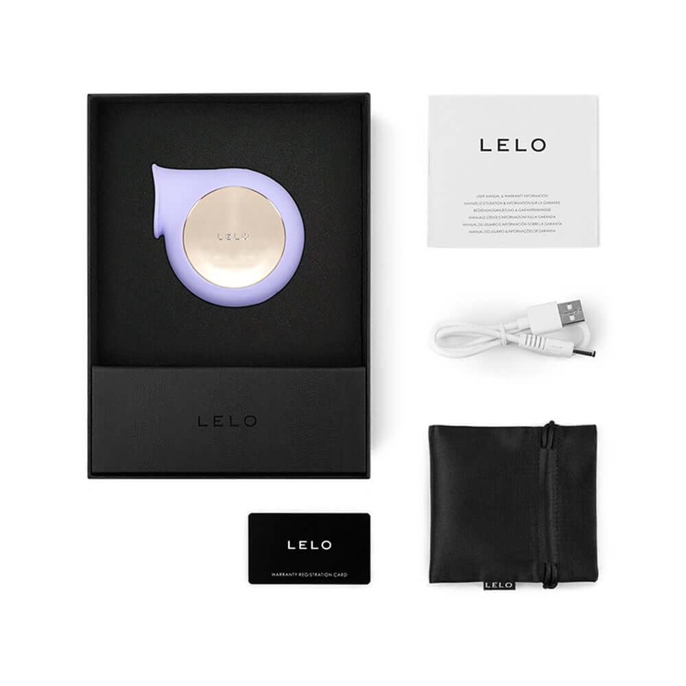 Lelo Sila Cruise Sonic Clitoral Stimulator Lilac in packaging with accessories and user manual.