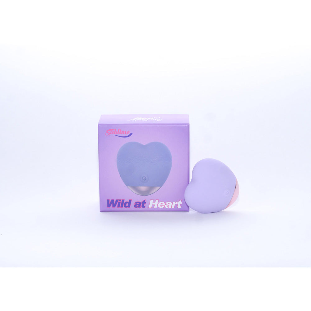 Sublime Wild At Heart Silicone Heart Shaped Vibe Lilac displayed next to its packaging in lilac color.