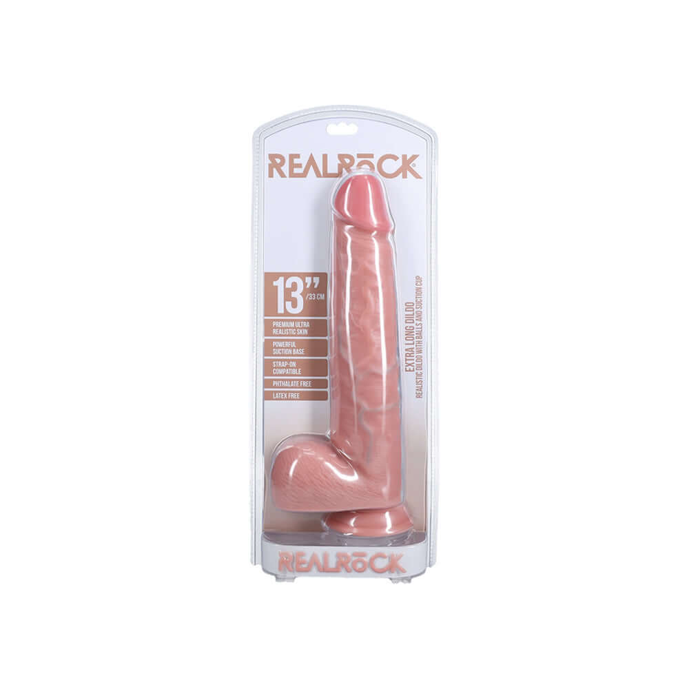 Realrock Extra Long Realistic Dildo With Balls 13 inch Flesh in packaging, lifelike design and durable material.