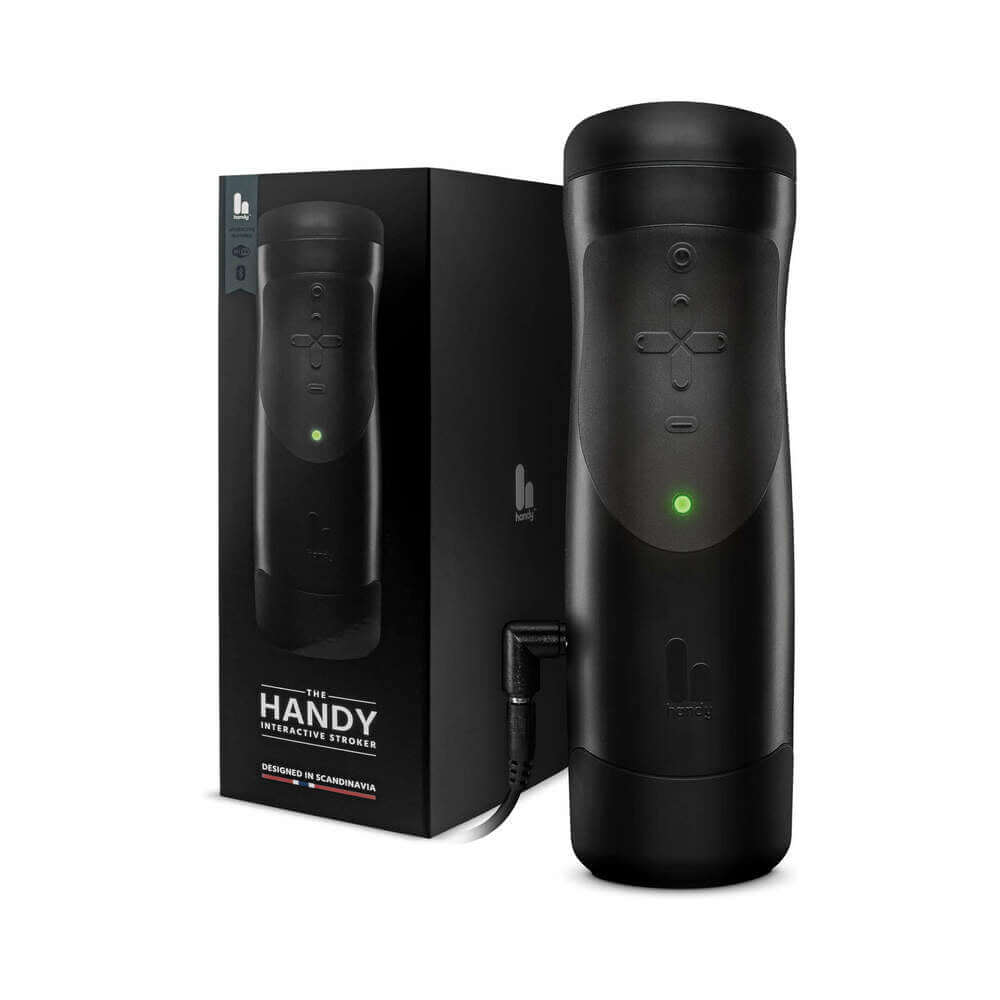 The Handy Interactive Stroker Black alongside its stylish packaging showcasing advanced features and design.