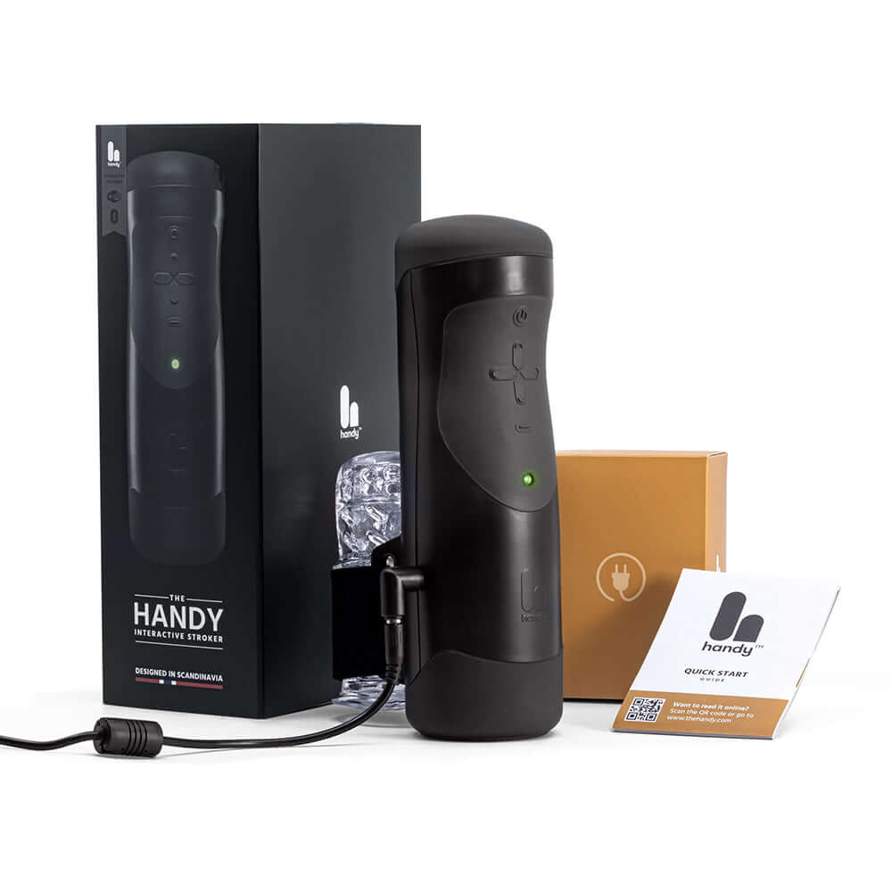The Handy Interactive Stroker Black with packaging and accessories, showcasing advanced interactive features.