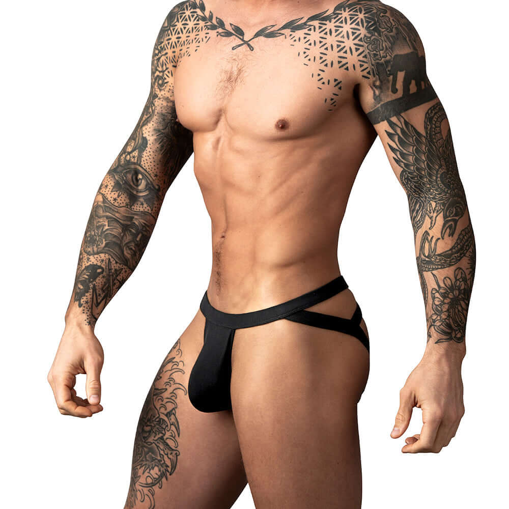 Male Power Eco Cozy Jock Black S M worn by a tattooed man, showcasing style and comfort in athletic wear.
