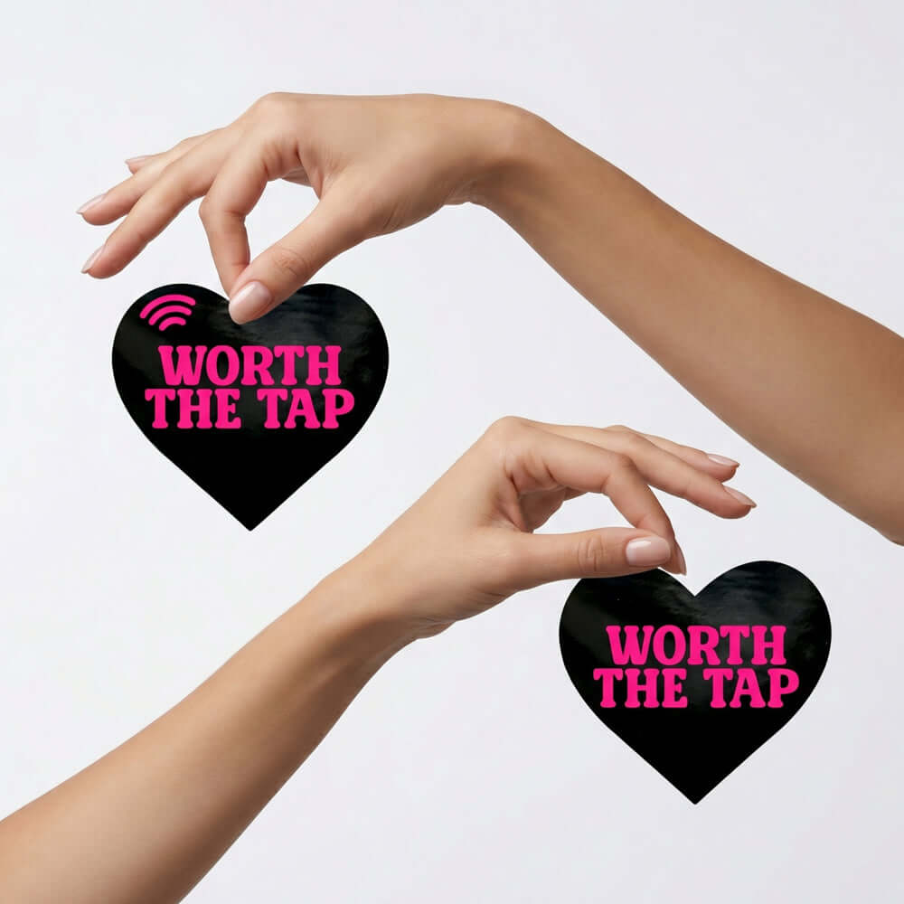 Neva Nude Worth The Tap Hot Pink Heart Smart Nfc Pasties held by hands for stylish engagement at events.