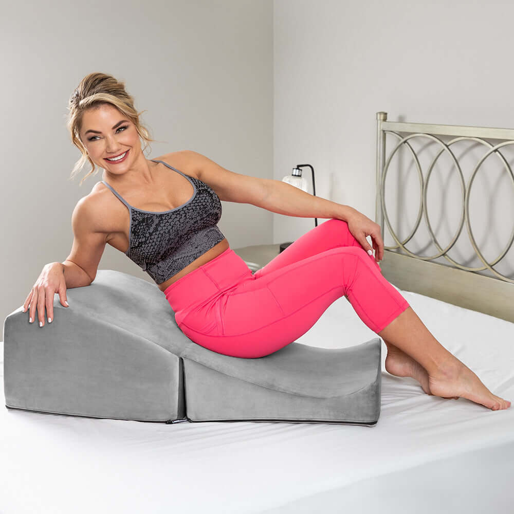 Liberator Flip Ramp Sex Positioning Pillow With Slip Cover Lush Grey being used for a comfortable and trendy pose.