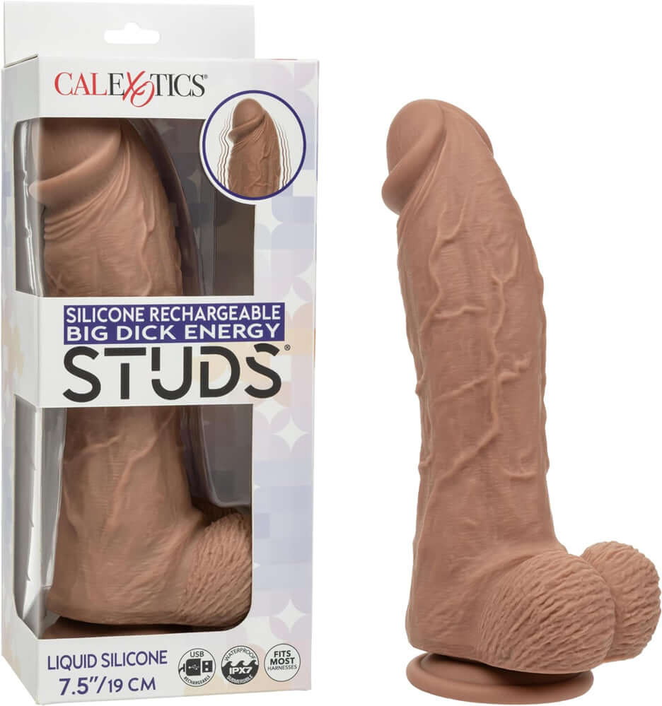 Silicone Rechargeable Big Dick Energy Studs Vibrator Brown in packaging, showcasing its lifelike textured shaft.