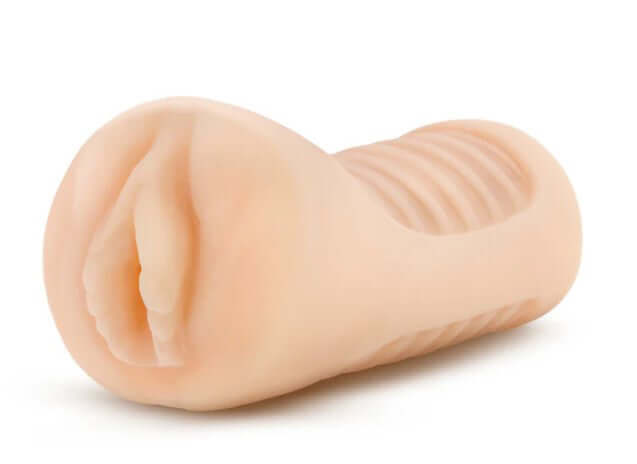 Enlust Georgia Male Masturbator With Bullet Vibrator Beige shown from side angle, featuring ribbed texture and soft material.