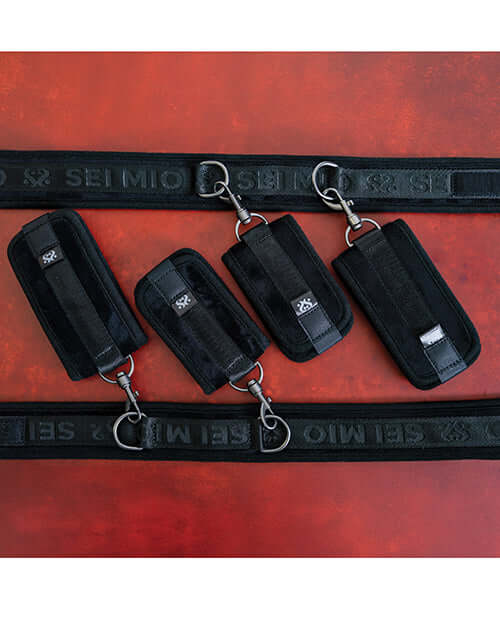 Sei Mio Pretty Thighed Up Thigh Wrist & Ankle Restraint set featuring elegant black straps and adjustable clips.