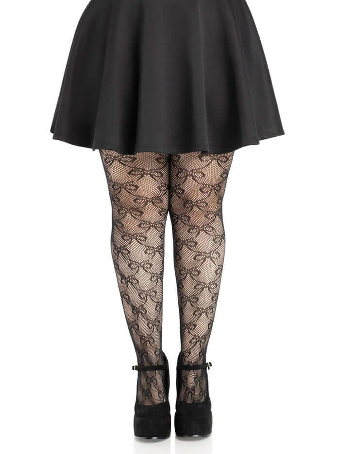 Leg Avenue Plus Size Bow Net Tights 1X 2X Black worn with a black skirt and heels, showcasing the elegant bow net pattern.