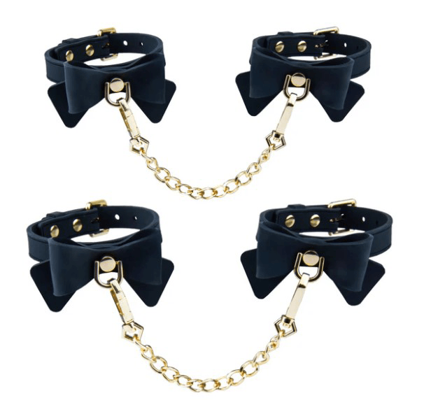 Temptasia Ardor Wrist & Ankle Restraints Black With Bow featuring stylish black silicone design and gold chain.