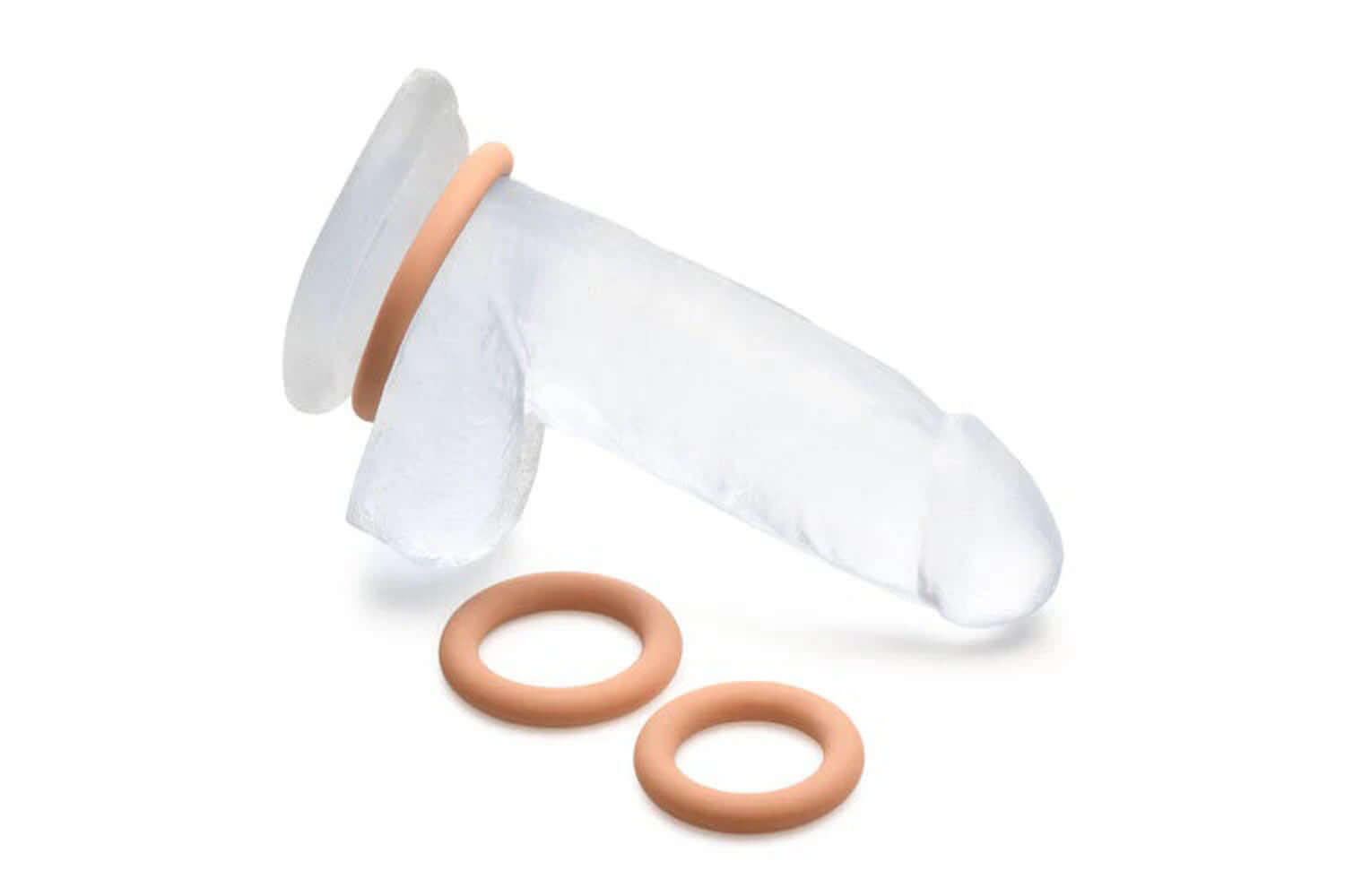 Jock Silicone Cock Ring Set - 3 graduated sizes in medium, phthalate-free and latex-free, shown on transparent model penis.