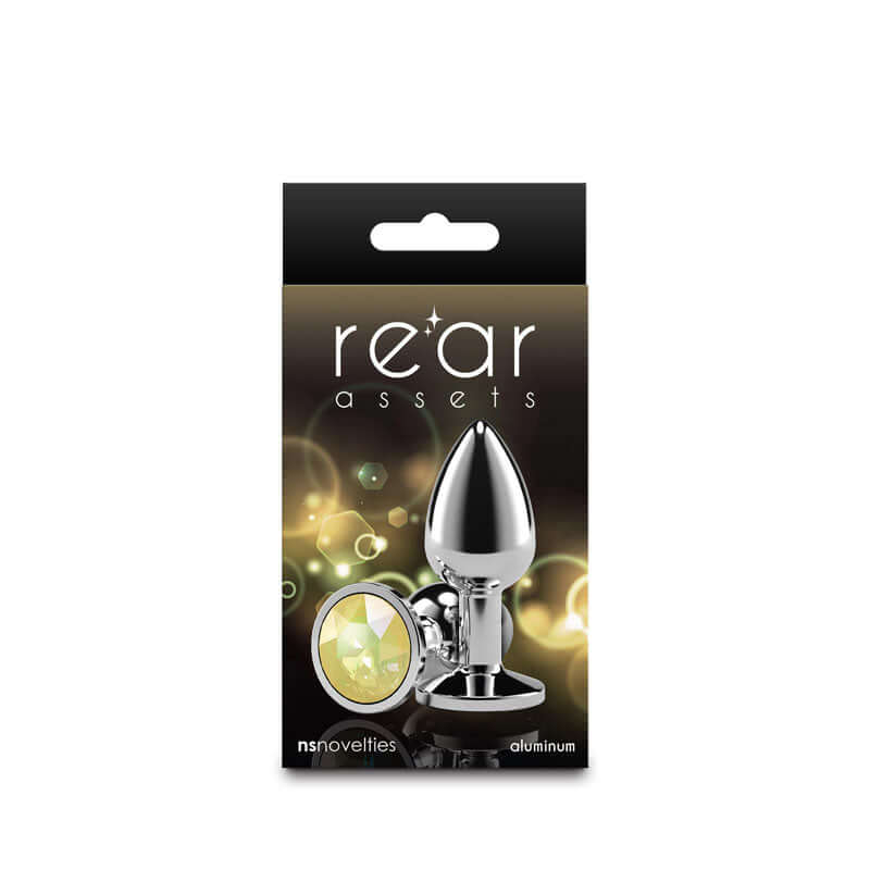 Rear Assets Silver Anal Plug Small Yellow Gem in packaging with chrome finish and yellow gem detail.
