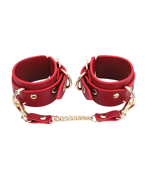 Kinky Play Box Federico Luxurious Leather Restraint Kit Red featuring elegant red cuffs with gold accents.