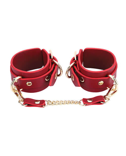 Kinky Play Box Federico Luxurious Leather Restraint Kit Red featuring elegant red cuffs with gold accents.