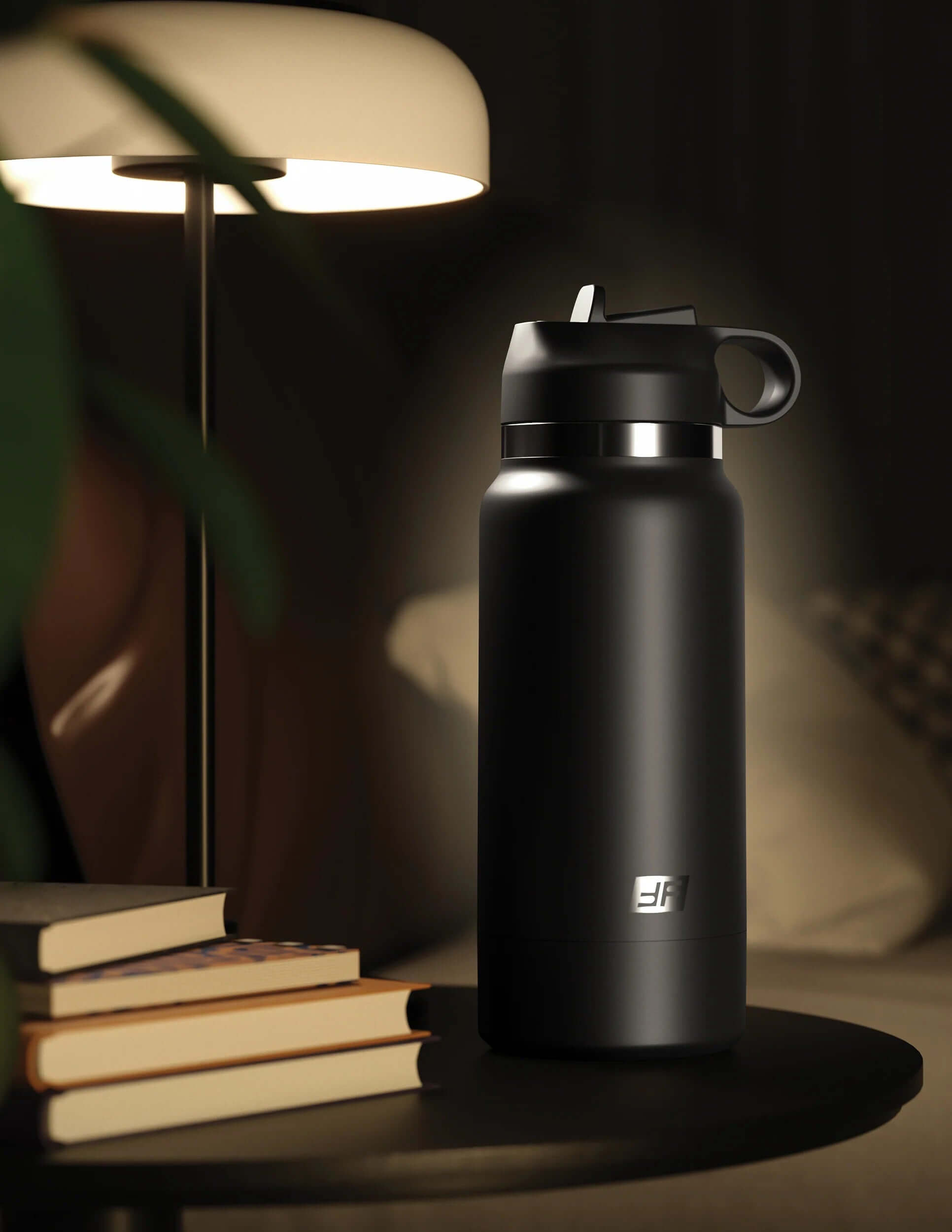 Black Fap Flask Thrill Seeker bottle with frosted finish beside a lamp and books for discreet hydration and adventure.