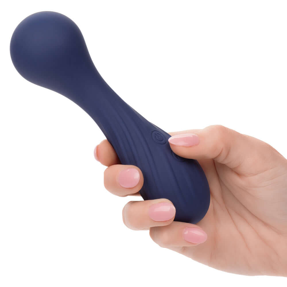Hand holding Charisma Temptation Compact Wand Massager in blue color