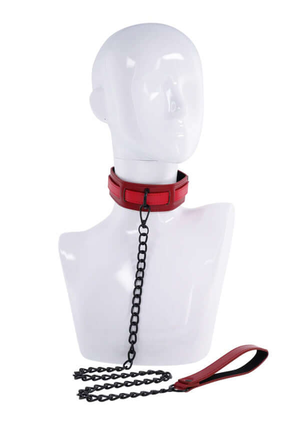 Ex's and Oh's collar and leash set featuring red faux leather collar and black chain leash, displayed on a mannequin.