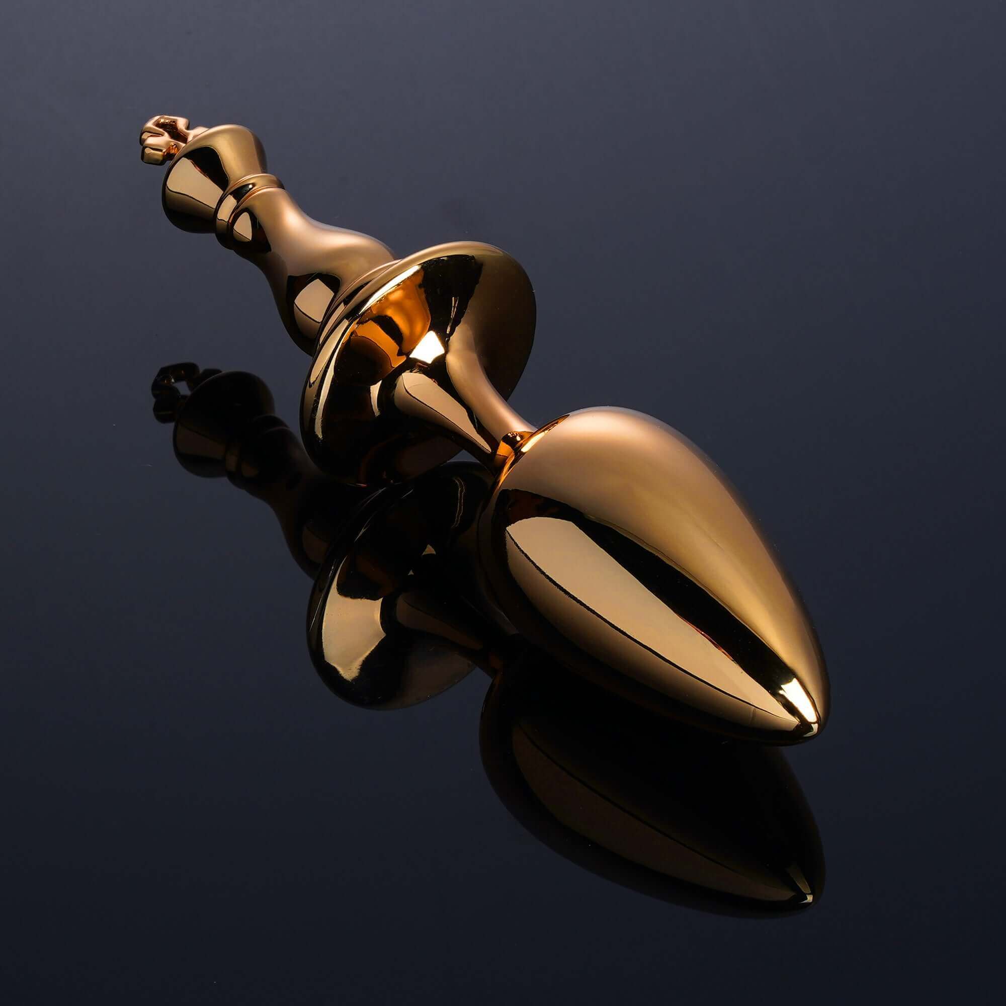 Gold King Butt Plug from "The Chess" Collection with ergonomic design for control and pleasure.