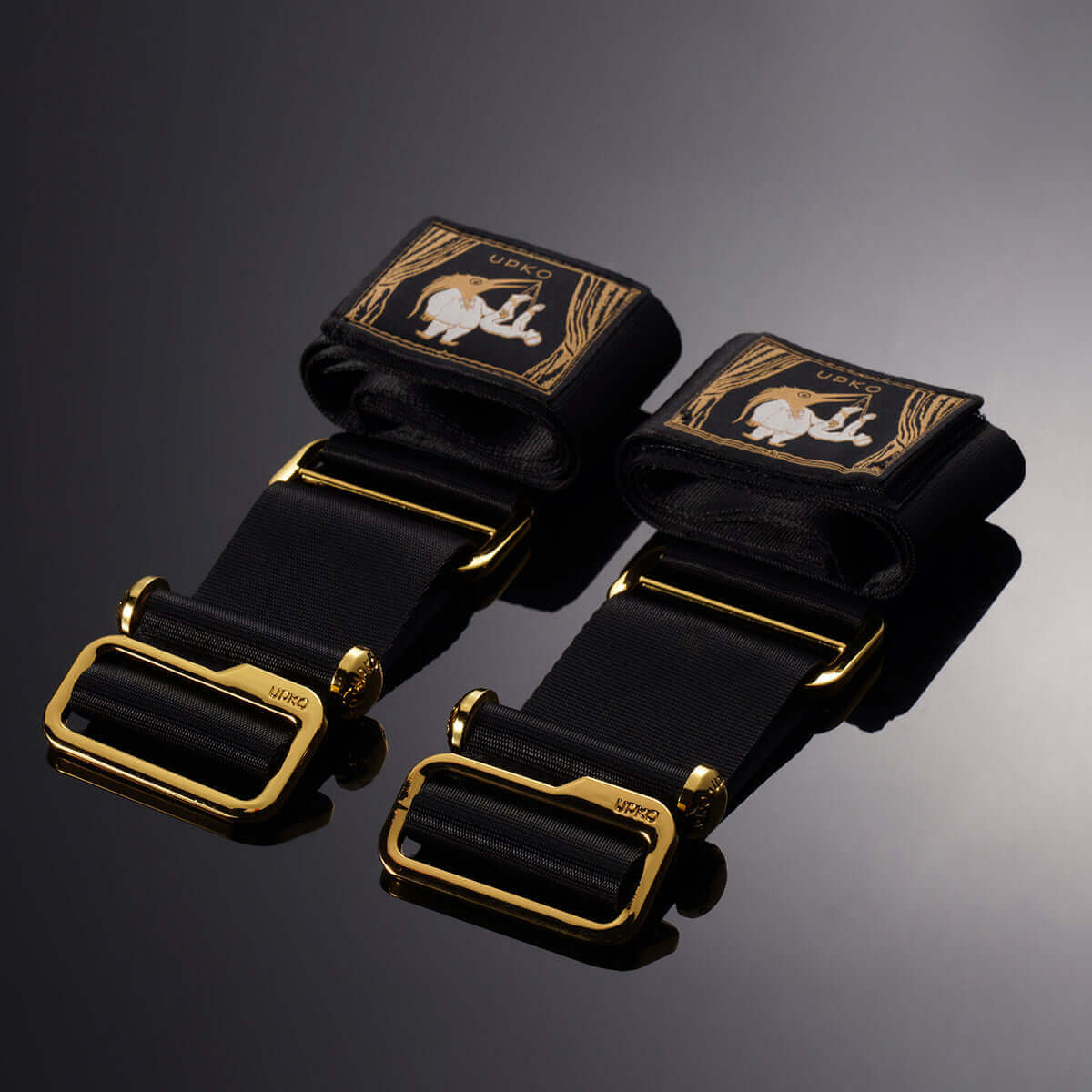 UPKO Under the Door Ankle Restraints featuring black nylon straps and gold buckles for unique S&M experiences.