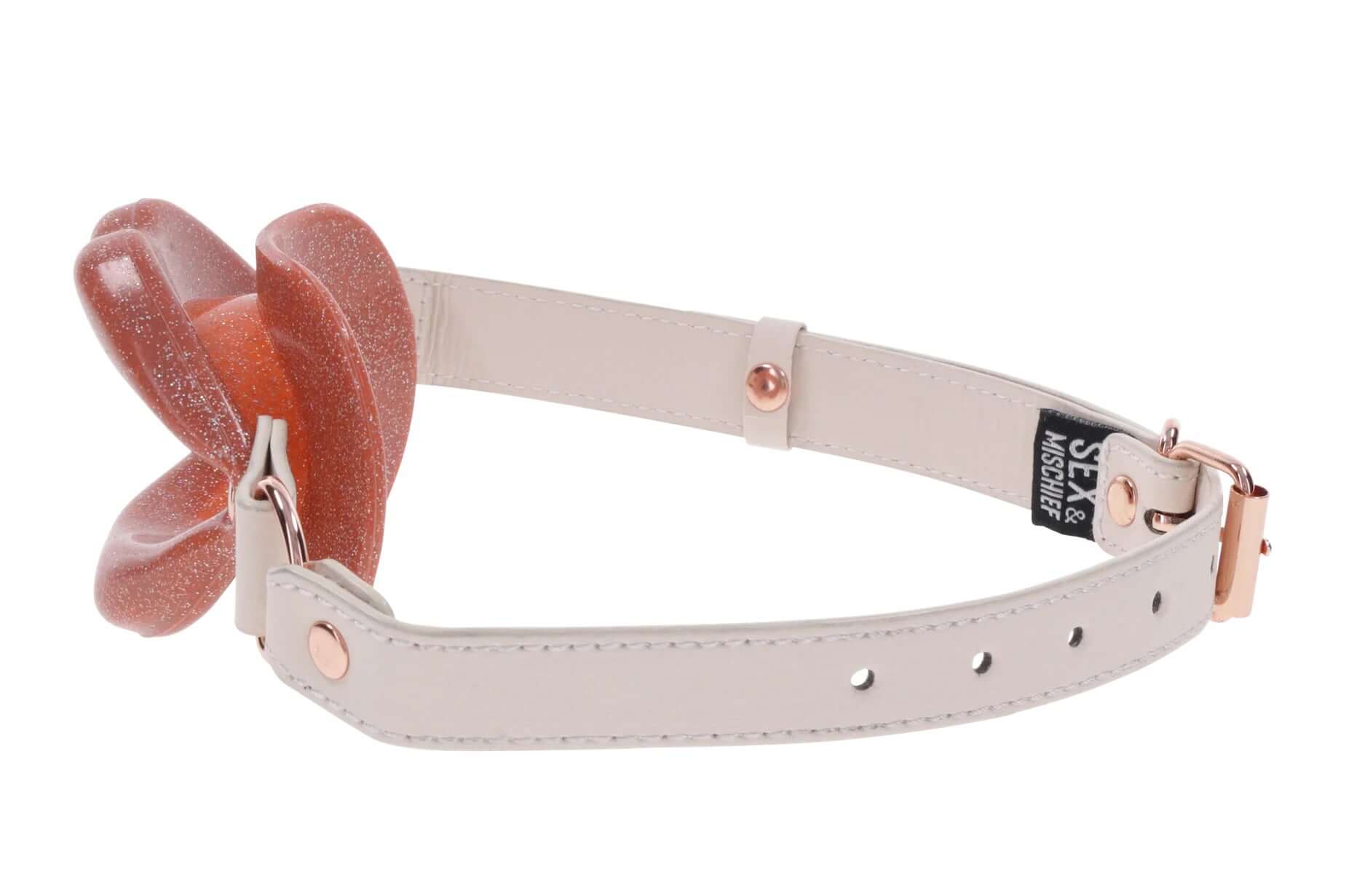 Peaches 'N Creame Silicone Lips gag in pink with faux leather buckle for secure fit and playful oral play