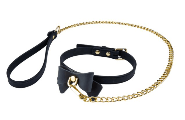 Temptasia Ardor Collar and Leash Black With Bow featuring a black collar with bow and gold chain leash.