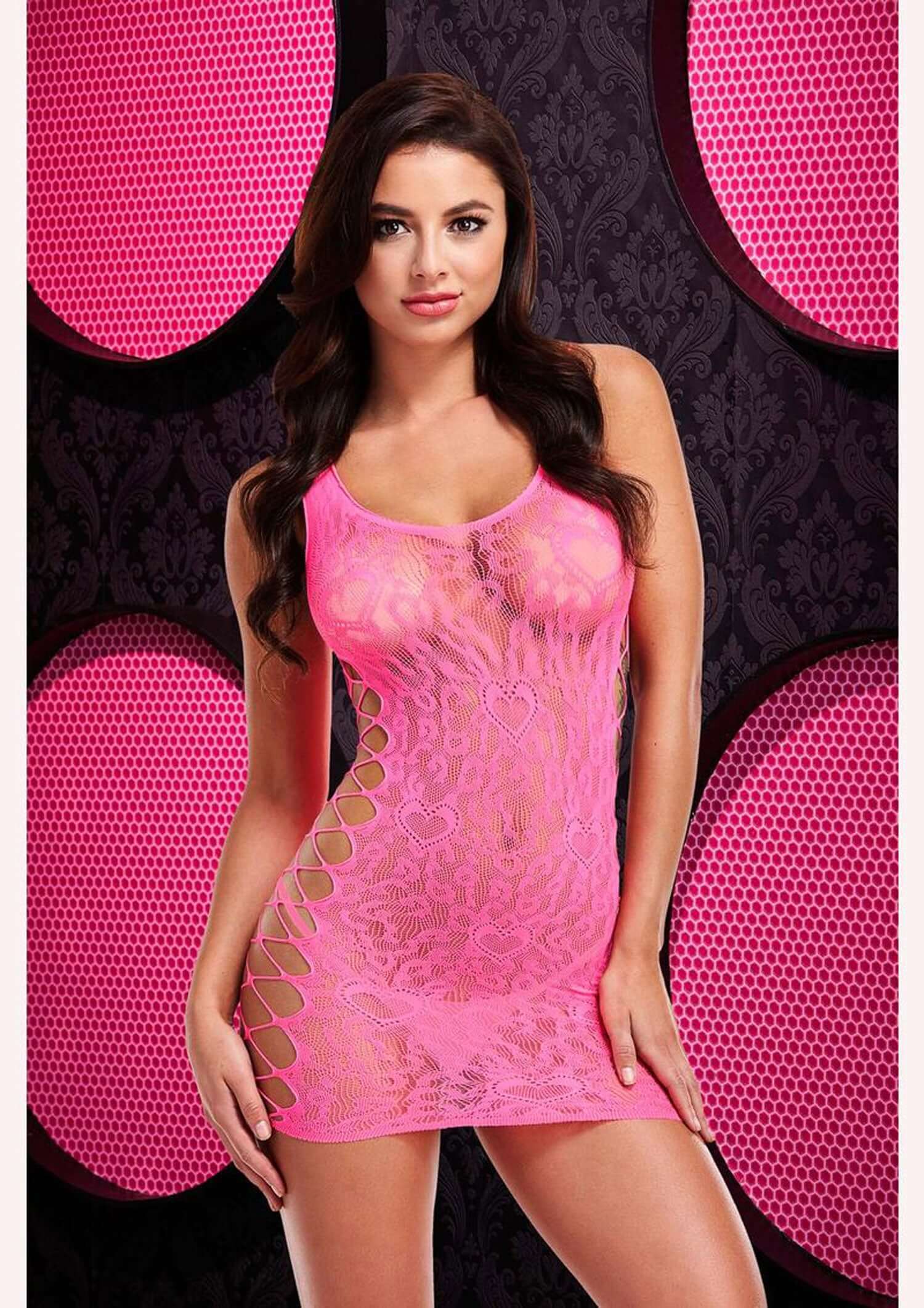 Pink leopard lace mini dress showcasing trendy clubwear fashion with intricate side cutouts.