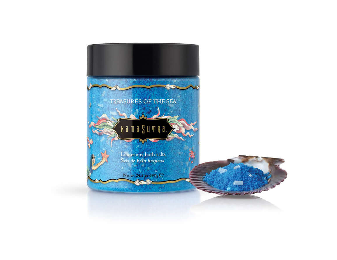 Kama Sutra Treasures of the Sea Bath Salts 24.5 Oz jar with blue bath salts in a shell.