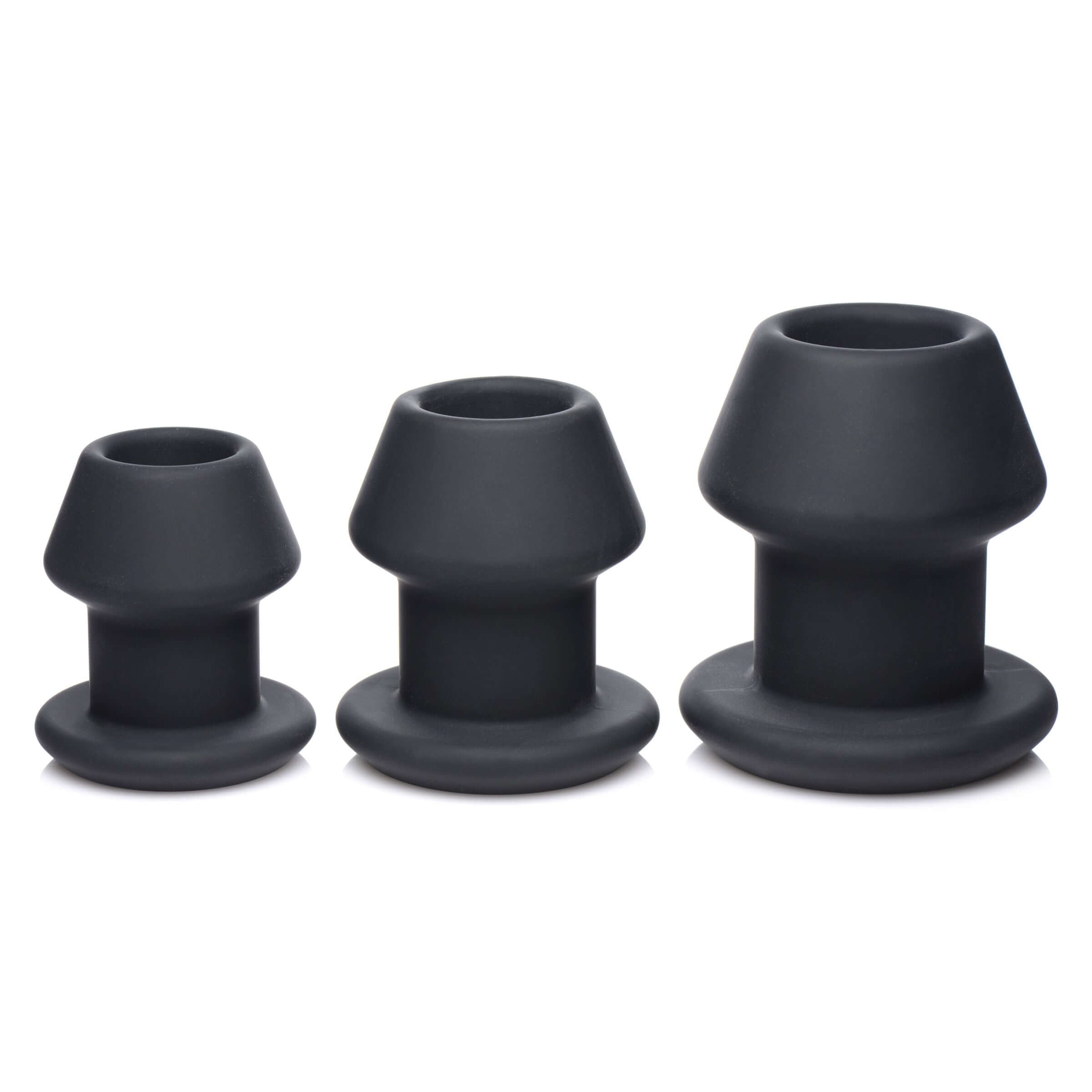 Gape-Grommets 3 Piece Hollow Silicone Anal Dilator Set featuring three progressively sized hollow dilators.