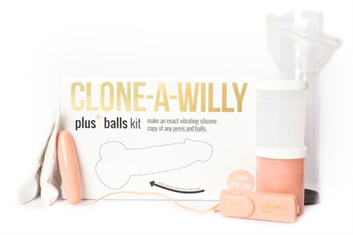 Clone a Willy Plus Balls Kit Light Skin Tone with casting materials and vibrating device on display.