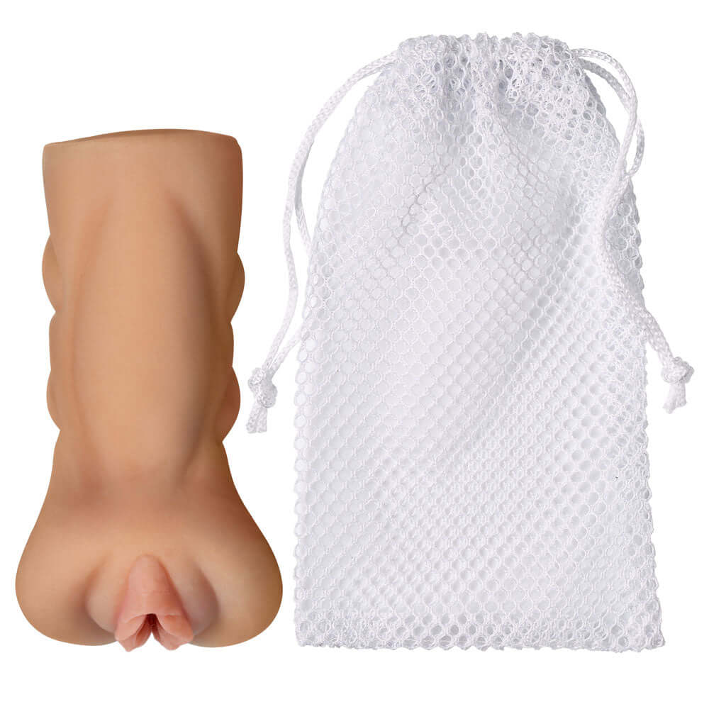 Cloud 9 Pocket Pussy Stroker Tan accompanied by a white storage bag, showcasing its compact and ergonomic design.