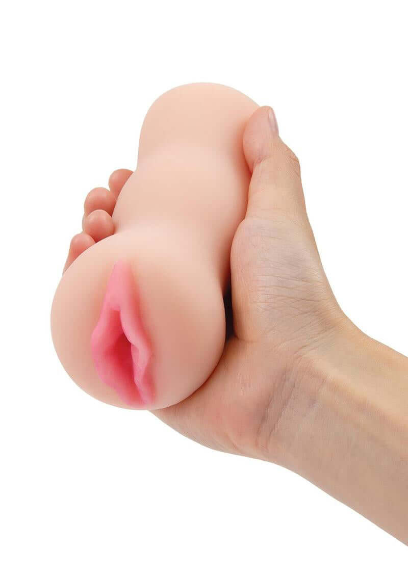 A person holding the ZOLO Stroke Off Super Tight Vibe Stroker Light, a realistic vibrating stroker designed for intense sensations.