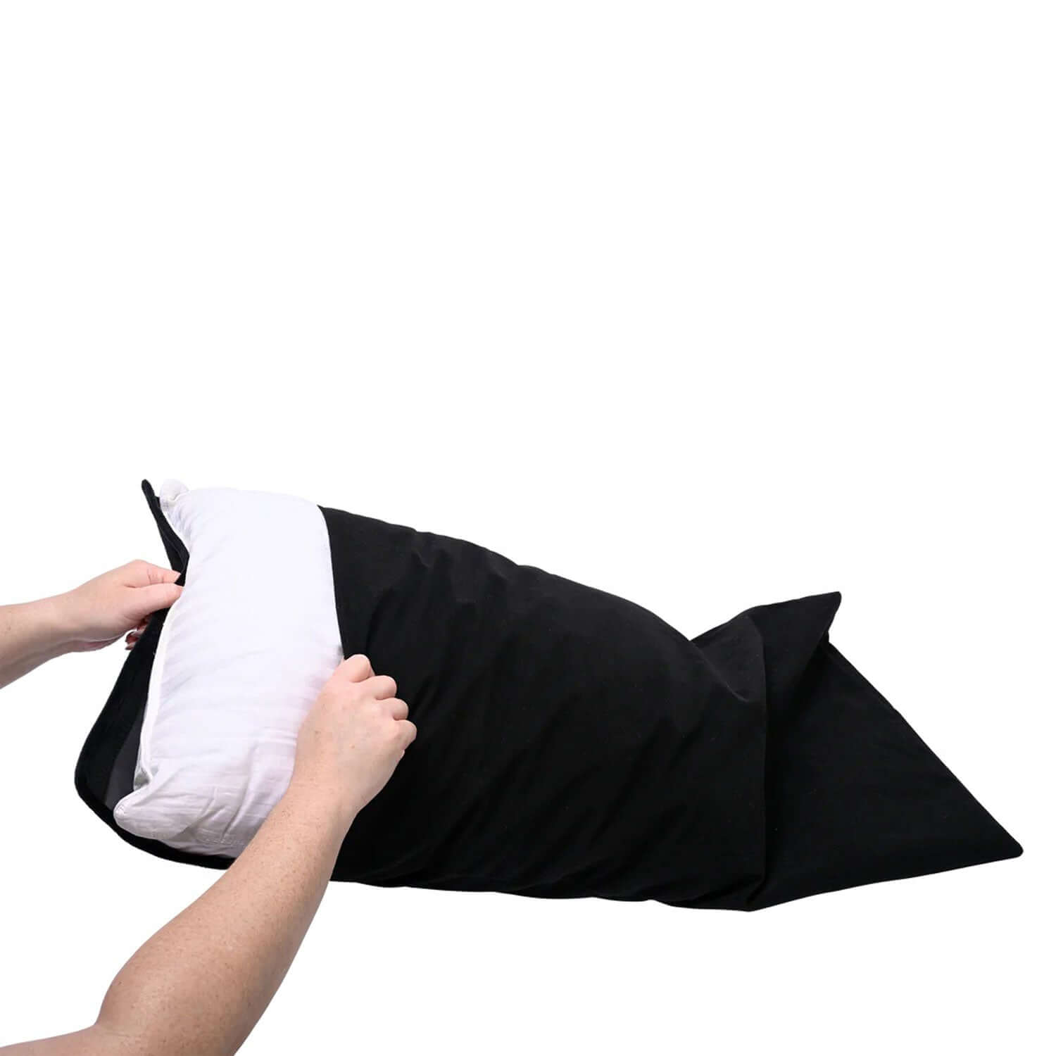 Black Pivot Pillow Protector being placed on a white pillow with hands, showcasing its soft fabric and secure hook and loop closure.