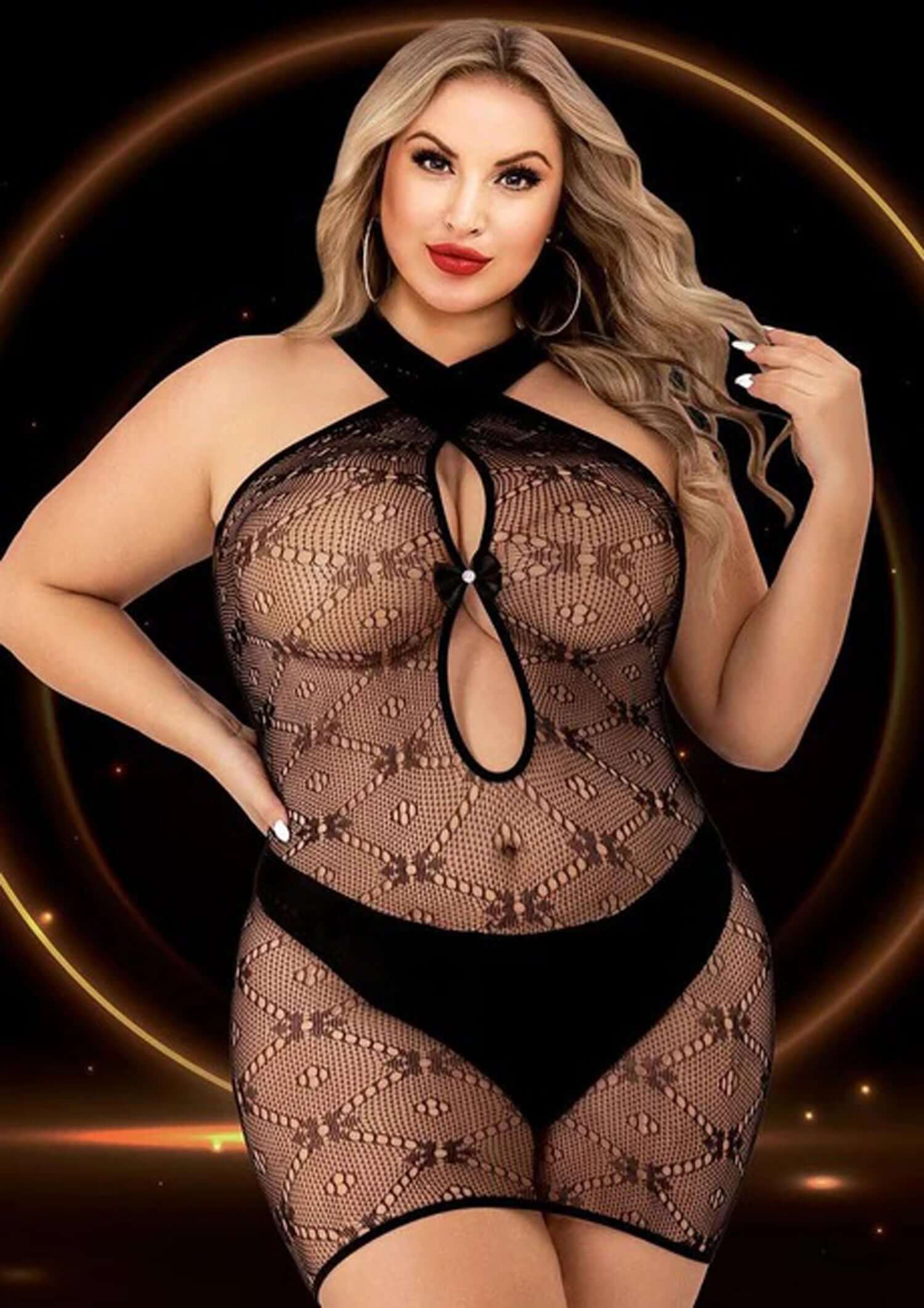 Halter top mini dress in black, featuring seductive see-through cutouts and curve-enhancing design for plus sizes.