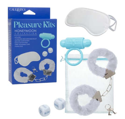 Pleasure Kits Honeymoon Collection featuring accessories like cuffs, eye mask, rechargeable bullet, and playful items.