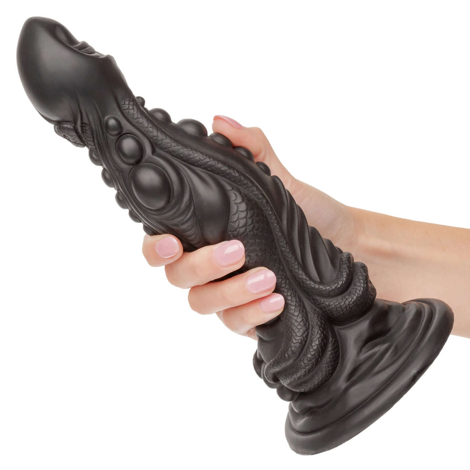 Hand holding Monster Dong The Colossus 9.75 inches black dildo with textured surface, made of premium liquid silicone.