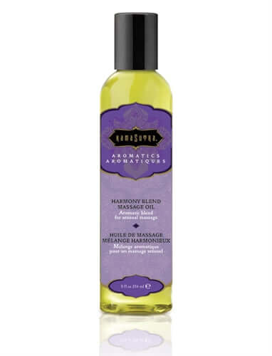 Kama Sutra Aromatic Massage Oil Harmony 8 Fl Oz in a clear bottle with a purple label and black cap.