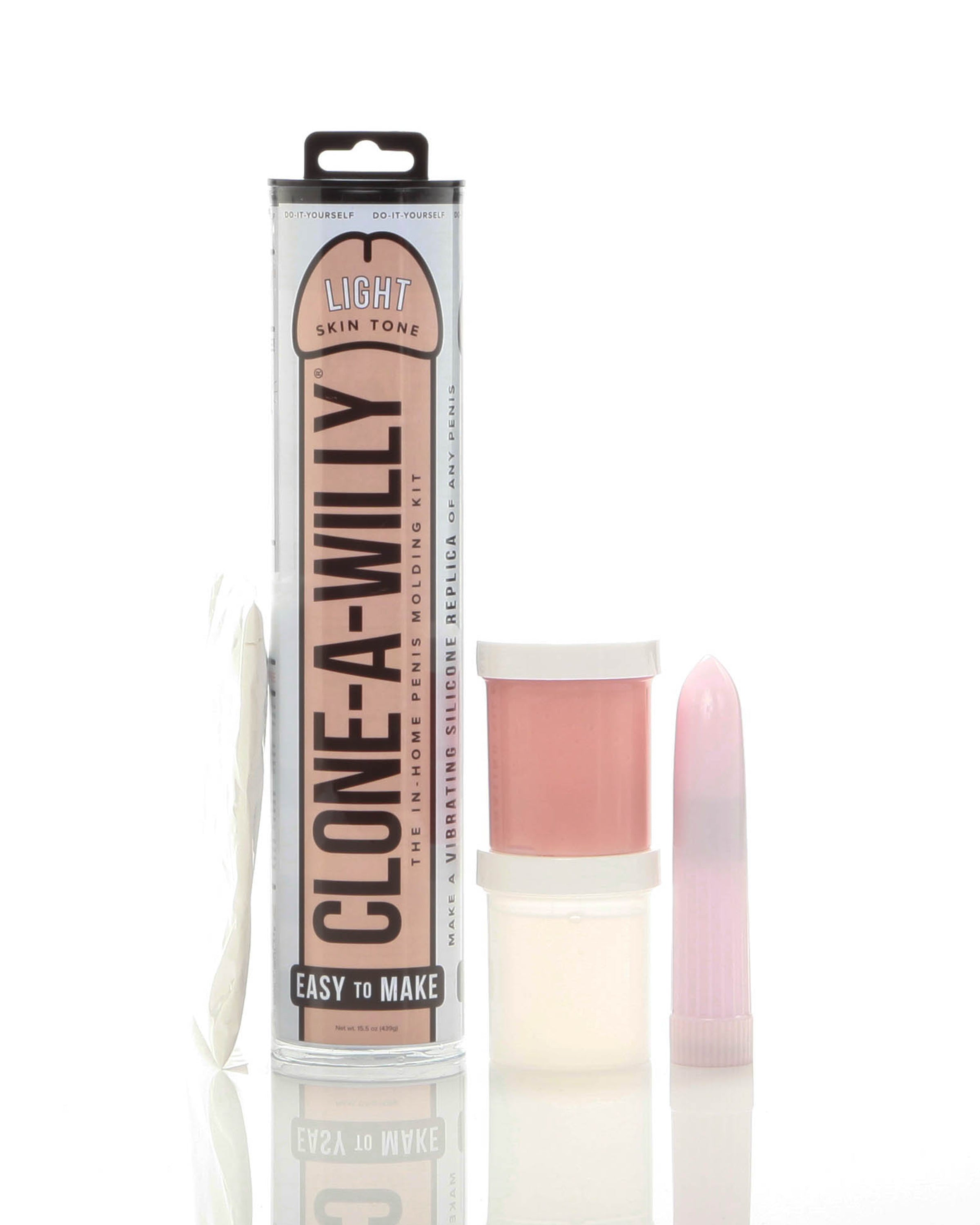 The Clone-a-Willy Kit Light Skin Tone packaging with silicone mold, vibrator, and instructional materials.
