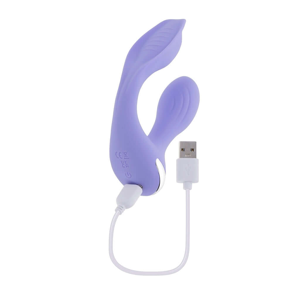 Lilac rabbit vibrator with multiple pleasure-rich textures and USB charging cable for hands-free dual stimulation.