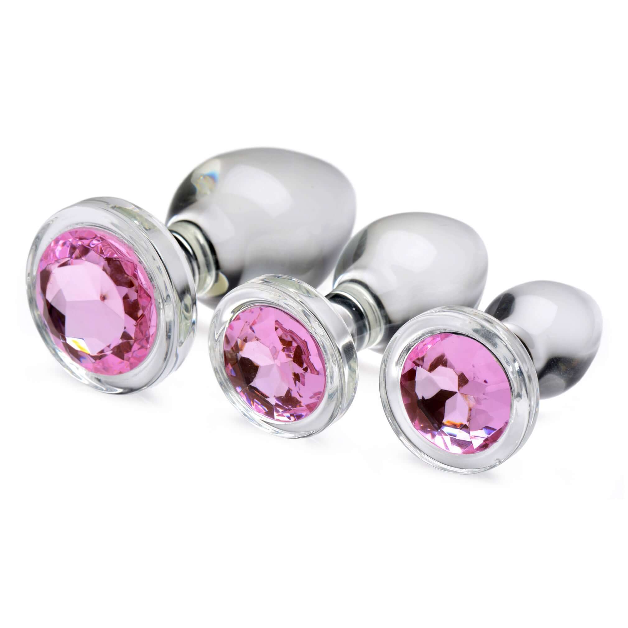 Pink Gem Glass Anal Plug Set showcasing three elegant glass plugs with dazzling pink gem bases.