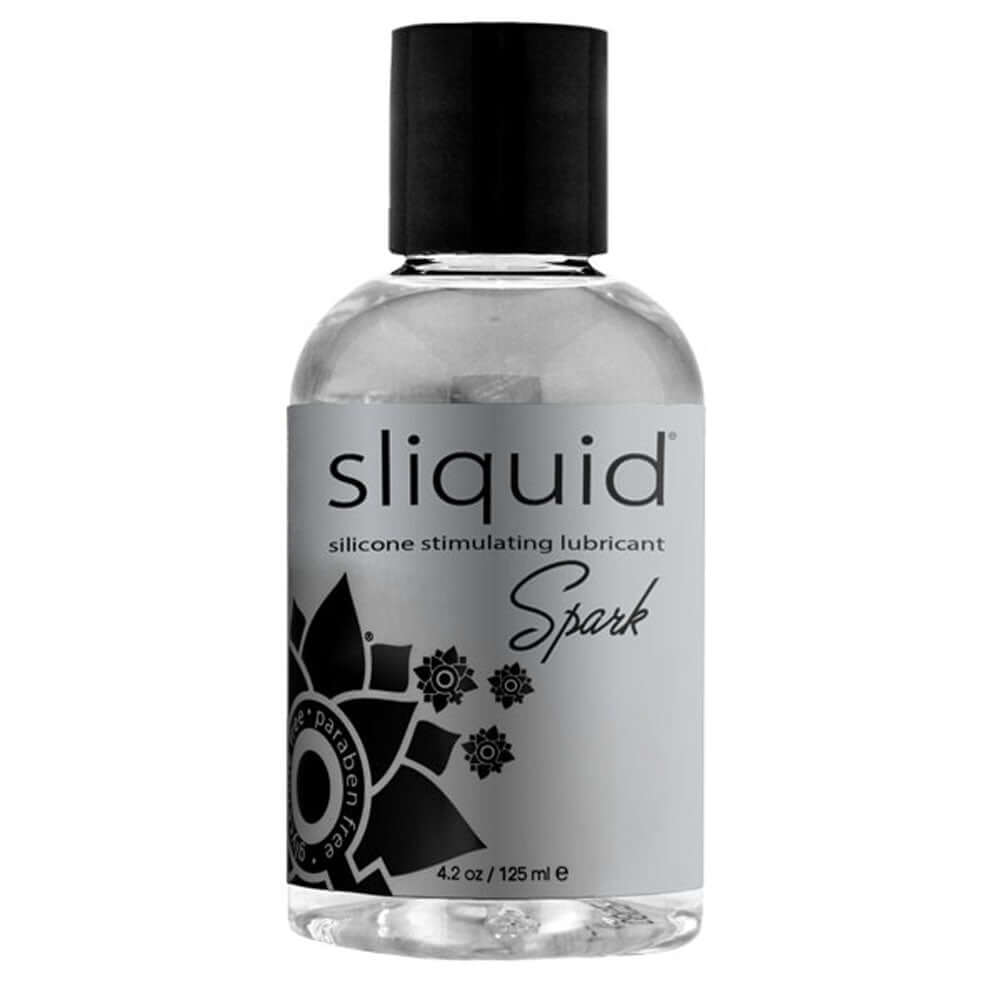 Sliquid Spark Silicone Lubricant 4.2 Oz bottle with sleek design and stimulating formula for enhanced intimacy.