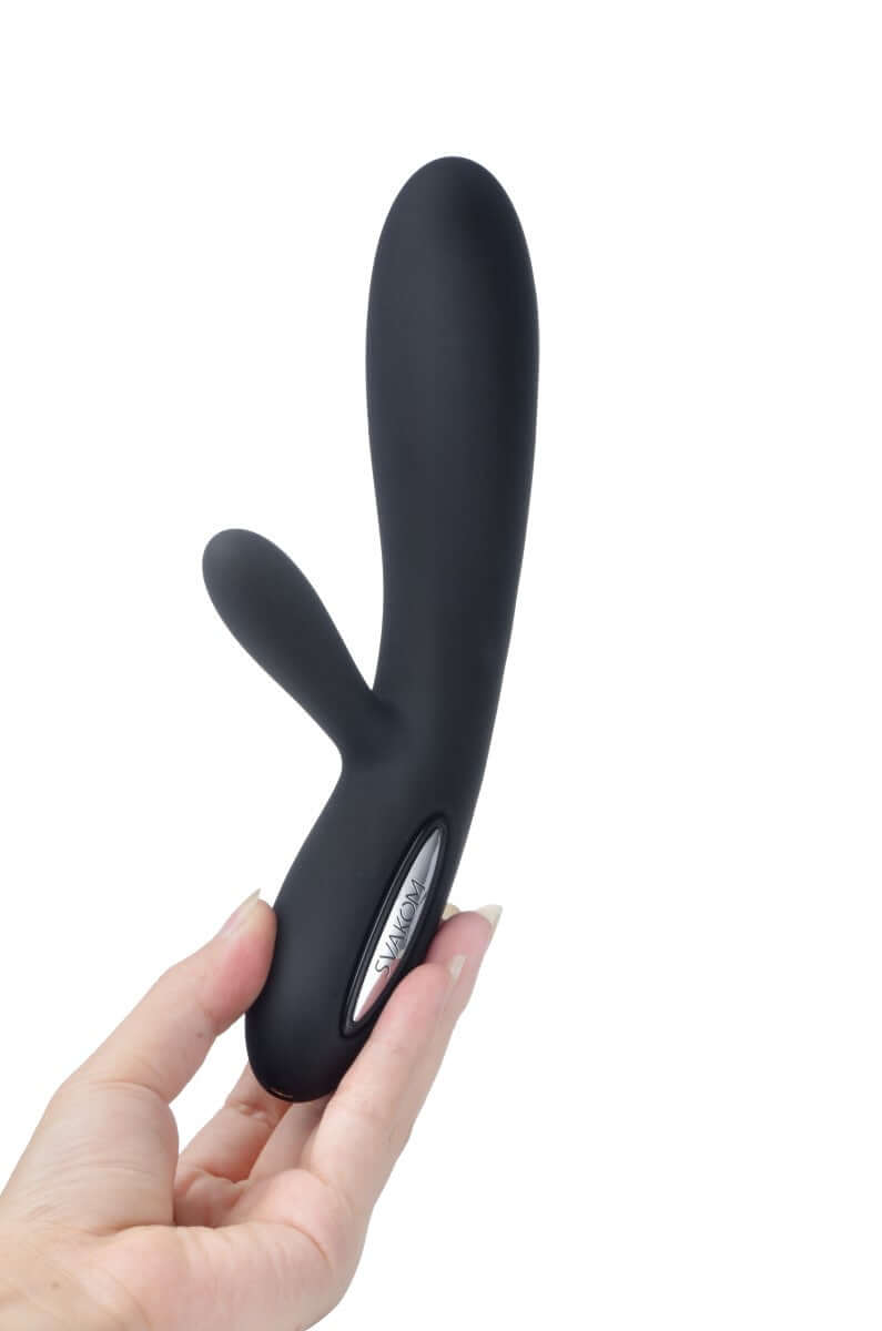 Svakom Lucas Dual-Motor G-Spot & Clitoral Vibrator Black held in hand, showcasing its sleek design.