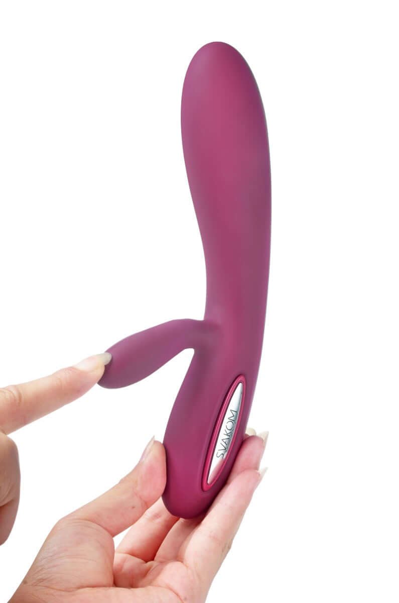 Svakom Lucas Dual-Motor G-Spot & Clitoral Vibrator Violet in hand, showcasing its sleek design and dual motors.