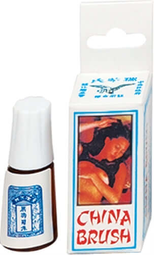 Bottle of China Brush herbal formula alongside its packaging, a traditional secret sex potion for enhancing intimacy.