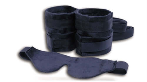 Beginner's Bondage Fantasy Kit featuring wrist and ankle restraints with a soft blindfold for playful adventures.