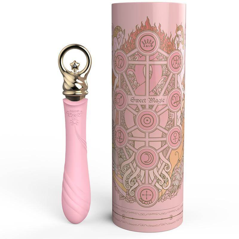ZALO Courage Pre-Heating Rechargeable G-spot Massager in Fairy Pink next to ornate packaging from the Sweet Magic Series.